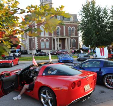 Corvettes parking around the Courthouse Square at the Welcomefest Party in Downtown Effingham