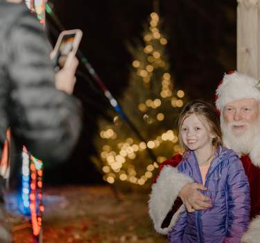 Little girl visits with Santa at the Walking Through Wonderland event