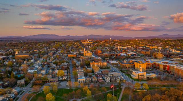 sunset glow over Burlington city and the distant mountains