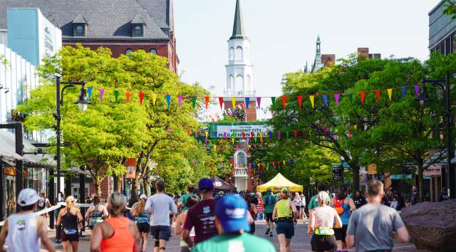 The Vermont City Marathon runners head up Church Street