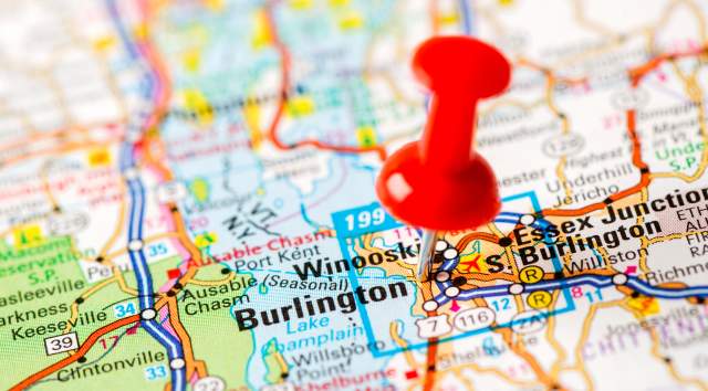 red push pin marking Burlington Vermont on a map