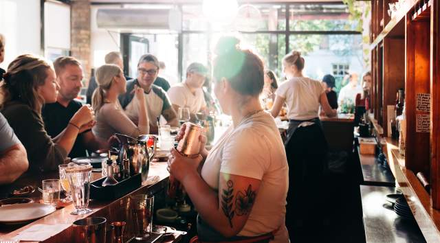 bar tender serving drinks and winter dining in Burlington Vermont