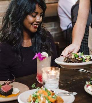 A group of friends enjoying a meal at a Downtown Salt Lake City Restaurant