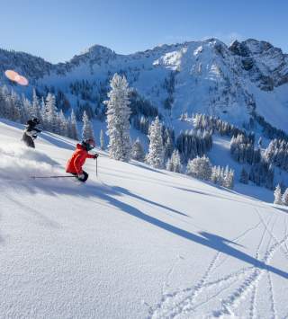 Skiers at Alta Ski Area in winter 2024