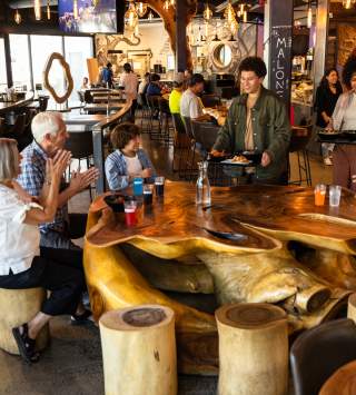 Family eating at the Gatway food hall, the HallPass
