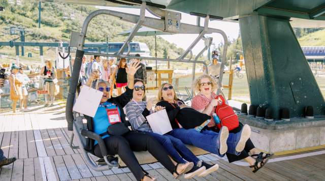 Group getting on a chairlift in the summer