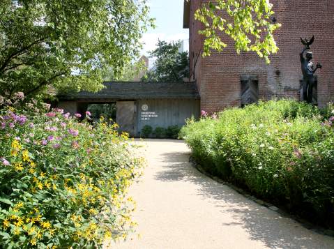 Path leading up to the entrance of a museum with signage that reads Brandywine Museum of Art