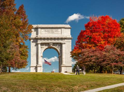 Valley Forge National Historical Park in King of Prussia with fall foliage filled trees standing around the iconic arch.