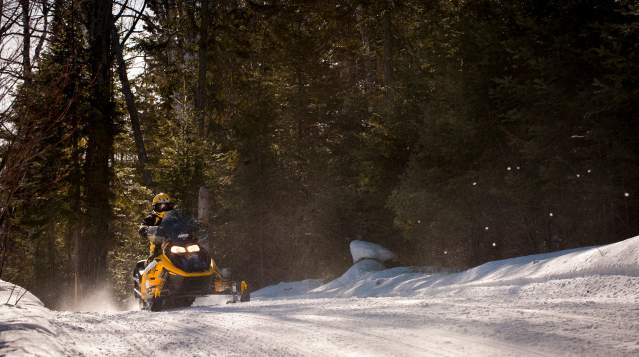 Snowmobile on groomed trail