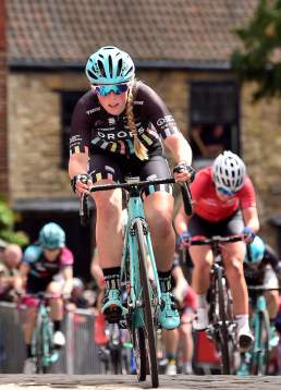 A woman cycling through the Cathedral Quarter, as part of the Lincoln Cycling Grand Prix