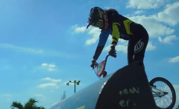 Image of Amanda Carr, BMX racer on starting line of bmx race track