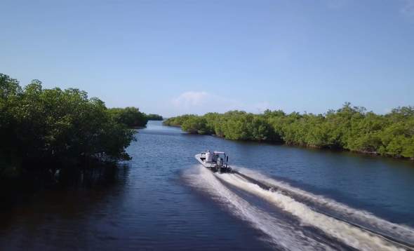 Boat leaving a wake in a Punta Gorda/Englewood Beach waterway