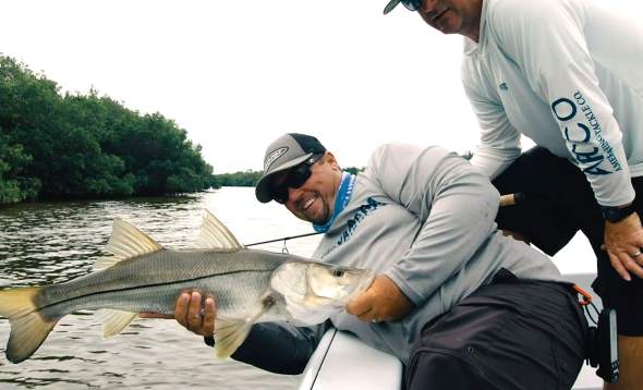 Capt. Jay Withers with a freshly caught Snook