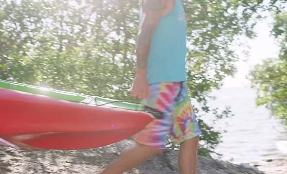 Aaron Koher of Glass Bottom Rentals transporting a kayak