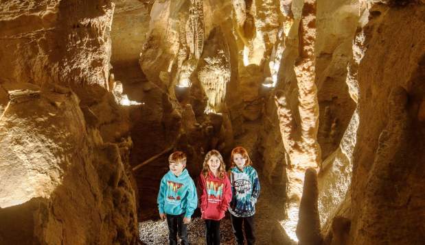 Picture of three kinds exploring Lincoln Cavers