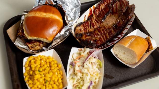 A tray of barbecue meat and sides from Spring Lake, NC's Noble Meats