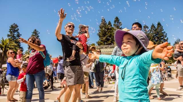 Families playing with bubbles