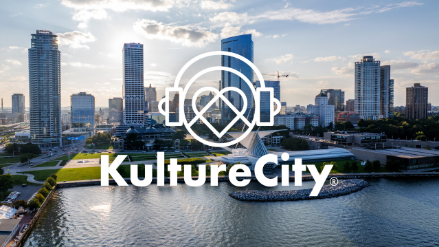 Milwaukee skyline along Lake Michigan with a KultureCity logo overlay in white
