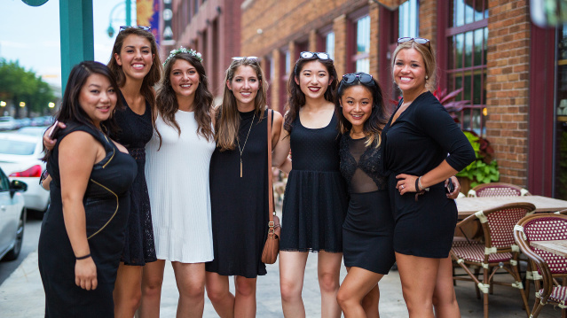bachelorette party smiling for group photo outside Third Ward