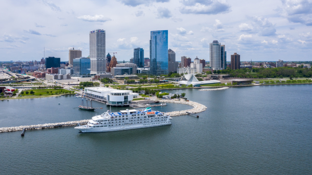 drone shot of the Pearl of the Mist Cruiseline in front of the Milwaukee skyline