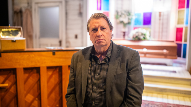 Mark Clements sits inside the Milwaukee Rep