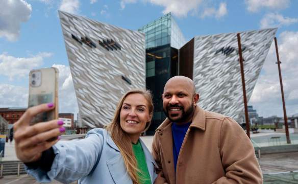 Couple taking a selfie in front of Titanic Belfast