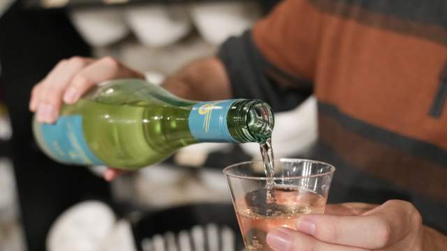 man pouring wine