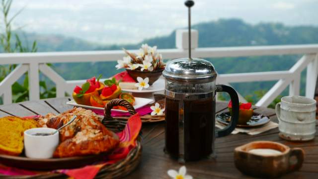 Image of coffee with food on table