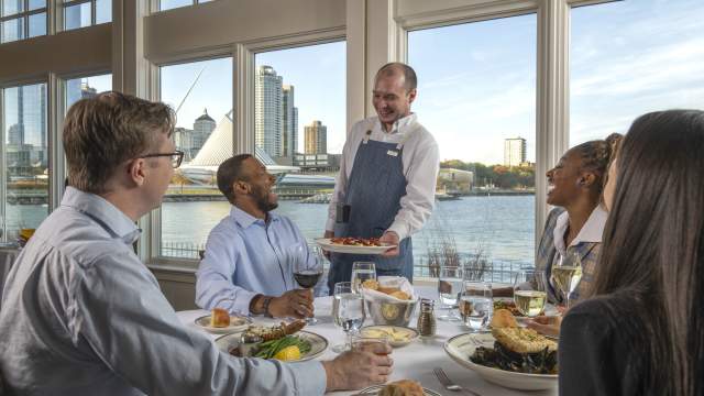 Interior-Server delivering Food to Window Table