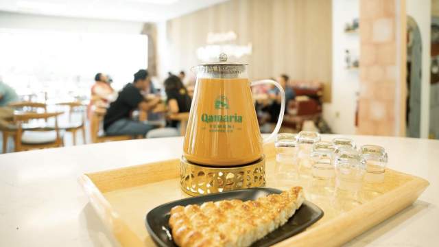 Coffee tray and pastry in bright room