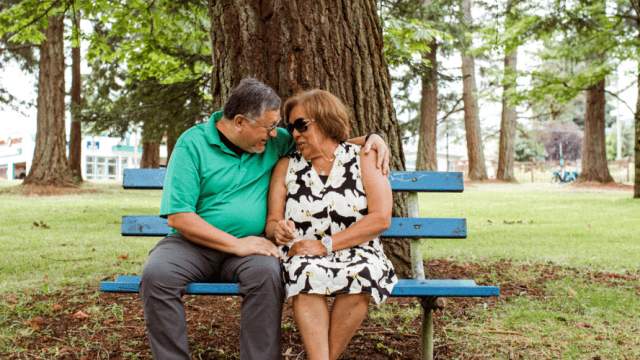 elderly couple on a park bench