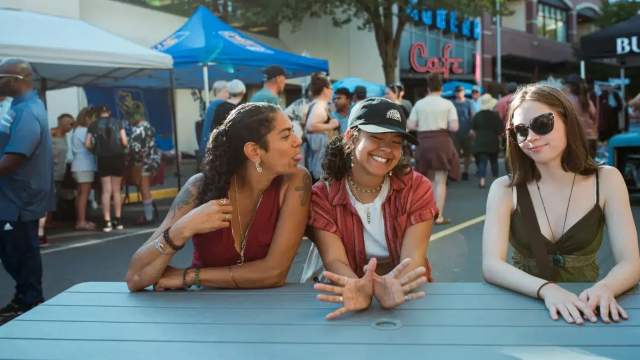 People-hanging-out-at-a-table outside
