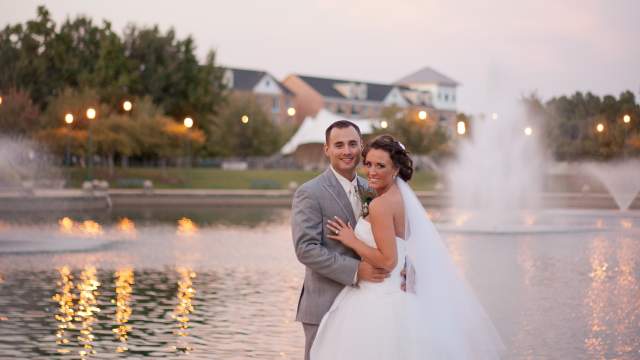 Bride & Groom Pose in Front of Fountains
