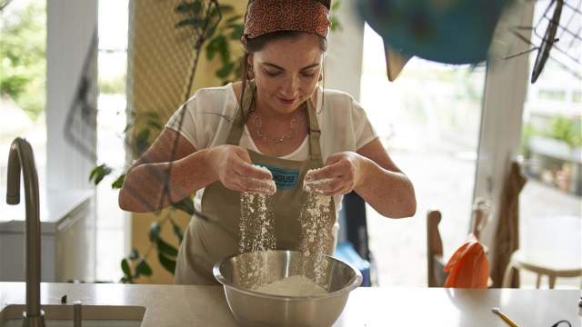Bronagh with a bowl of flour in front of her baking