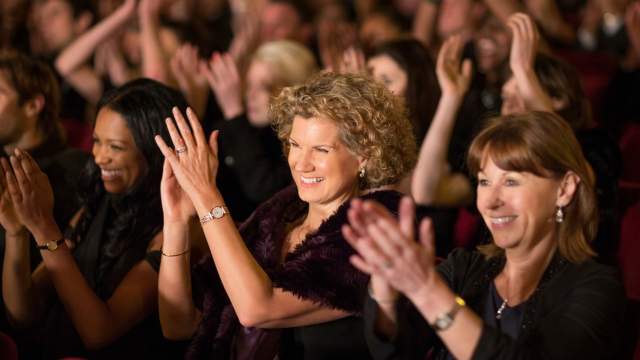 An audience claps at the Dr. Phillips Center for the Performing Arts in Orlando.