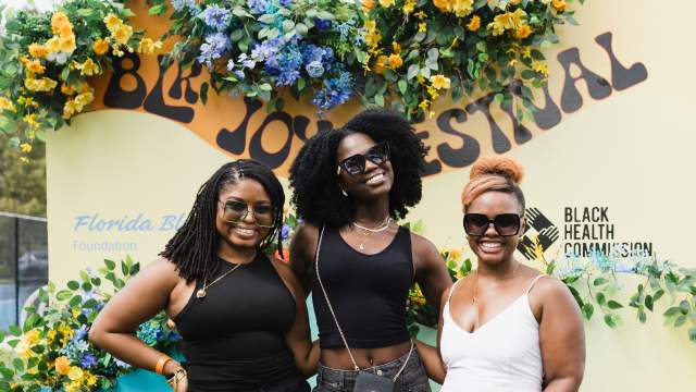 Three women celebrate at the BLK Joy Festival in Orlando.