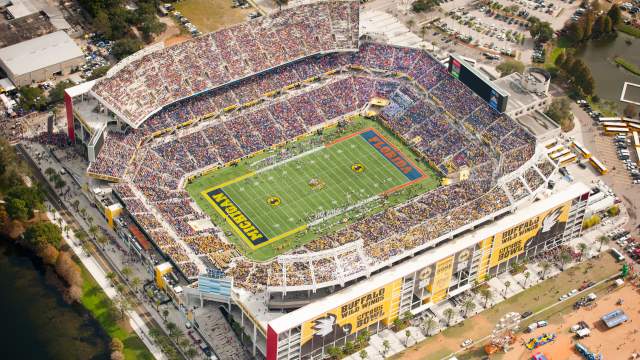 Aerial view of a fan-filled Camping World Stadium during a football game