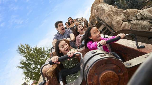 Sisters on the Seven Dwarfs Mine Train Rollercoaster at the Magic Kingdom in the Walt Disney World Resort.