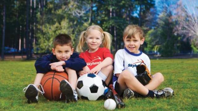 Three children at sports camp