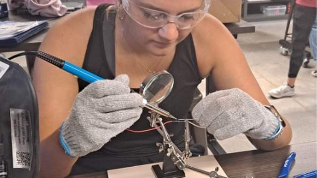 Woman soldering