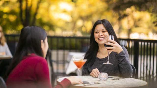 2 women enjoying cocktails at Peyrassol Cafe at Southport