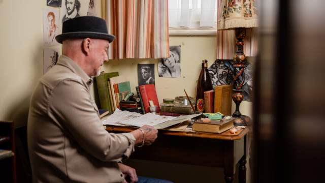 A man sitting at a desk in Dylan Thomas' Birthplace