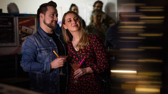 A couple enjoying drinks at Elysium Gallery