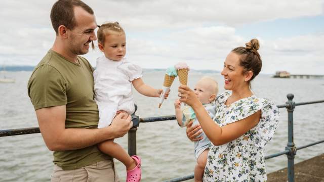 A family enjoying an ice-cream in mumbles, swansea