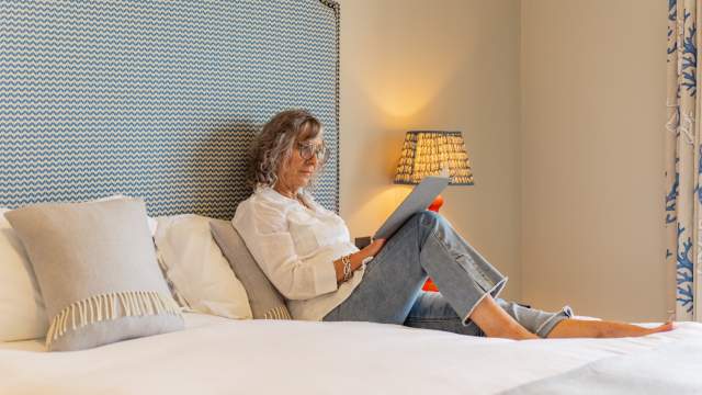 Places to stay in Swansea, boutique hotel Swansea, woman reading in hotel