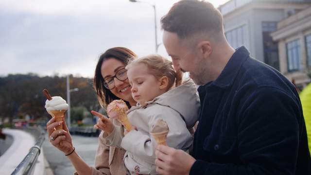 A family enjoying ice-creams in Mumbles