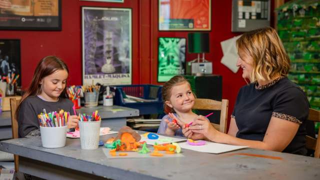 A family taking part in a crafts workshop