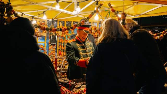 A shopkeeper in a military costume