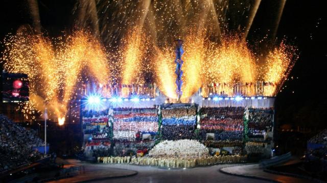 In this February 8, 2002, file photo, fireworks burst over the athlete tribune at the Rice-Eccles Olympic Stadium in Salt Lake City during the Opening Ceremonies for the 2002 Olympic Winter Games.