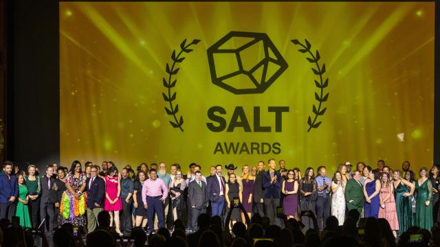 All of the 2025 Salt award nominees on stage with a golden yellow backdrop that says Salt Awards